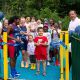 Young campus resident, Yusuf Yusupov, opens our new playground and basketball court with University of Sussex women's basketball team player Amani Al Zawawi