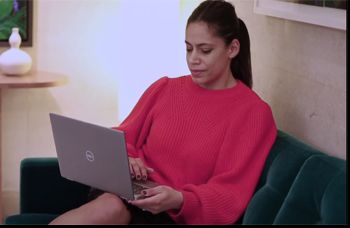 Woman studying an online Masters with her laptop