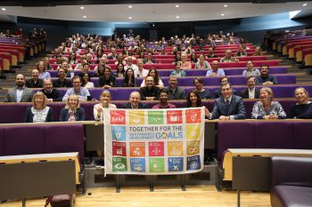 Business School staff raise the SDG flag