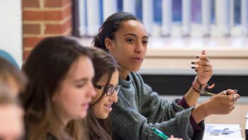 Female Student in a class discussion