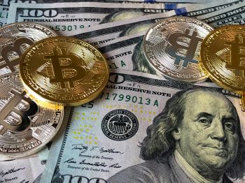 US dollar notes and gold coins