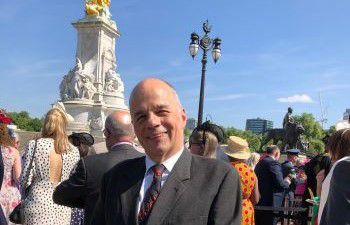 Professor David Ruebain pictured outside Buckingham Palace