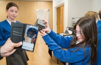 Two students using the merge cube in a presentation at school during MidSussex Science Week