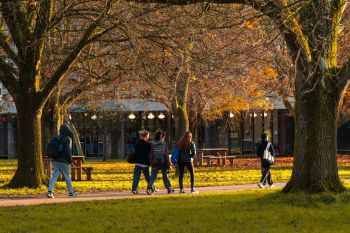 Two people walking on campus