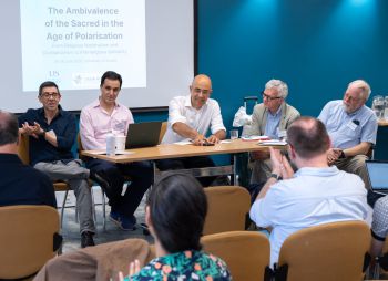 Conference panel with scholars from around the world