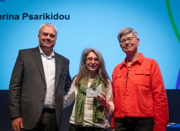 Dr Katerina Psarikidou (centre) collecting the Environmental Sustainability award from Chief Operating Officer Jim Andrews (left) and Vice-Chancellor Professor Sasha Roseneil (right).