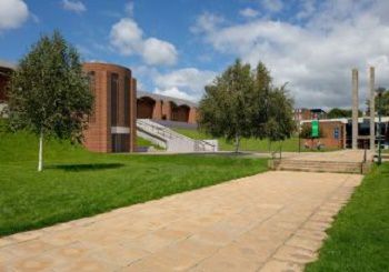 An image showing the proposed new Library entrance including a new brick tower containing a lift and a new ramp along the top of the Library's grassy bank