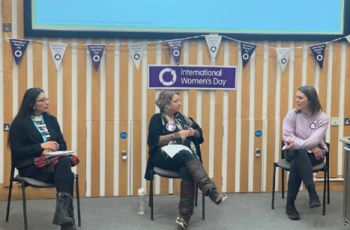 A photo of three colleagues from Life Sciences during an event for International Women's Day