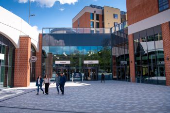 People walking in front of a University building